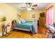 Bright bedroom with hardwood floors, ceiling fan and yellow walls at 1012 Rawlinson Rd, Rock Hill, SC 29732