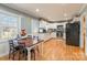 Kitchen with white cabinets, stainless steel appliances, and wood floors at 1012 Rawlinson Rd, Rock Hill, SC 29732