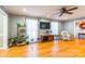 Bright living room featuring hardwood floors, large windows, and a ceiling fan at 1012 Rawlinson Rd, Rock Hill, SC 29732