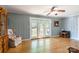 Cozy living room with hardwood floors, French doors, and a comfortable armchair at 1012 Rawlinson Rd, Rock Hill, SC 29732