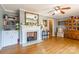 Living room with hardwood floors, fireplace, and built-in shelving at 1012 Rawlinson Rd, Rock Hill, SC 29732