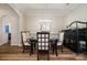 Traditional dining room features hardwood floors, sophisticated lighting, and a decorative sideboard at 10149 Elizabeth Crest Ln, Charlotte, NC 28277