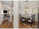 Elegant dining room with a decorative light fixture, hardwood floors, and neutral decor at 10149 Elizabeth Crest Ln, Charlotte, NC 28277