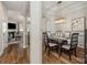 Elegant dining room with a decorative light fixture, hardwood floors, and neutral decor at 10149 Elizabeth Crest Ln, Charlotte, NC 28277