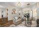 Living room features hardwood floors, modern décor, and open access to the kitchen and dining areas at 10149 Elizabeth Crest Ln, Charlotte, NC 28277