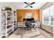 Comfortable home office with natural light, built-in shelving, and a functional workspace at 10149 Elizabeth Crest Ln, Charlotte, NC 28277