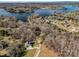 Aerial view of a waterfront property showcasing its proximity to a large lake and the surrounding wooded landscape at 108 Three Oaks Ln, Kings Mountain, NC 28086