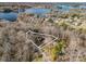 An aerial view of a property, outlined by a white border, revealing its location amidst dense trees near the water at 108 Three Oaks Ln, Kings Mountain, NC 28086