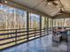 Inviting covered back porch offers serene views of the surrounding trees and nature at 108 Three Oaks Ln, Kings Mountain, NC 28086