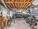 Open basement with exposed wood ceiling, cement floors and door leading outside at 108 Three Oaks Ln, Kings Mountain, NC 28086