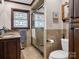 Bathroom features stained glass window, tile flooring, and a glass door shower at 108 Three Oaks Ln, Kings Mountain, NC 28086