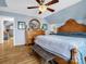 Bedroom features wood floors, ceiling fan and a glimpse of a walk-in closet at 108 Three Oaks Ln, Kings Mountain, NC 28086