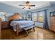 Bedroom with wood floors, a ceiling fan, and a bench at the foot of the bed at 108 Three Oaks Ln, Kings Mountain, NC 28086