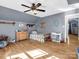 Well lit bedroom with wood floors, a ceiling fan, and a large window at 108 Three Oaks Ln, Kings Mountain, NC 28086