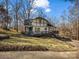 Charming two-story home with a welcoming front porch, American flag and beautiful landscaping at 108 Three Oaks Ln, Kings Mountain, NC 28086