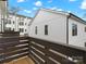 Private balcony with dark brown railings overlooks neighboring townhomes at 1122 Pegram Crossing Dr, Charlotte, NC 28205