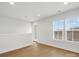 Well-lit bedroom with hardwood floors and access to a hallway at 1122 Pegram Crossing Dr, Charlotte, NC 28205