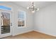 Bright bedroom with wood floors and a door to a balcony at 1122 Pegram Crossing Dr, Charlotte, NC 28205