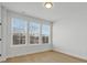 Bedroom with three windows, hardwood floors, and neutral walls at 1122 Pegram Crossing Dr, Charlotte, NC 28205