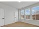 Bright bedroom with hardwood floors, neutral walls and multiple windows at 1122 Pegram Crossing Dr, Charlotte, NC 28205