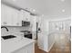 Modern kitchen with white cabinets, quartz countertops, and stainless steel appliances at 1122 Pegram Crossing Dr, Charlotte, NC 28205