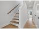 Modern staircase with light wood and white risers at 1122 Pegram Crossing Dr, Charlotte, NC 28205