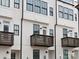 Modern townhome exteriors with dark window frames and balconies at 1122 Pegram Crossing Dr, Charlotte, NC 28205