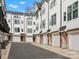 Row of townhomes with attached garages and landscaping at 1122 Pegram Crossing Dr, Charlotte, NC 28205