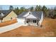 Aerial view of a charming house with driveway at 1135 Rudder Cir, Salisbury, NC 28146