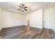 Expansive main bedroom with tray ceiling and wood-look floors and ensuite bath at 1135 Rudder Cir, Salisbury, NC 28146