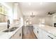 Modern kitchen with white cabinets, granite countertops, and stainless steel appliances at 1135 Rudder Cir, Salisbury, NC 28146