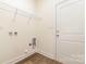 Laundry room with hardwood floors, wire shelving, and white door and trim at 1135 Rudder Cir, Salisbury, NC 28146