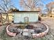 Landscaped backyard with charming brick garden and shed at 12 Maple St, Great Falls, SC 29055