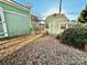 Two green sheds in backyard; one is a barn style at 12 Maple St, Great Falls, SC 29055