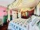 Cozy bedroom featuring a four-poster bed and fireplace at 12 Maple St, Great Falls, SC 29055