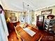 Bright dining room with large table and wood hutch at 12 Maple St, Great Falls, SC 29055