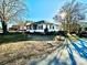 Ranch style home with a screened porch and landscaped yard at 12 Maple St, Great Falls, SC 29055