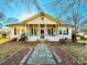 Charming one-story home with a front porch and landscaped yard at 12 Maple St, Great Falls, SC 29055