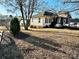 Side view of a ranch home with a large yard at 12 Maple St, Great Falls, SC 29055