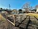 Fenced garden area with wooden gate and arbor at 12 Maple St, Great Falls, SC 29055