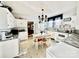 Eat-in kitchen with white cabinets, a tiled floor, and a farmhouse sink at 12 Maple St, Great Falls, SC 29055