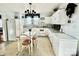 Galley kitchen with white cabinets, tiled floors, and stainless steel appliances at 12 Maple St, Great Falls, SC 29055