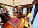 Cozy living room with hardwood floors, fireplace, and bookcases at 12 Maple St, Great Falls, SC 29055