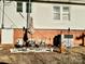 Small patio with table, chairs, and umbrella at 12 Maple St, Great Falls, SC 29055