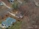 An aerial view of the home and its surroundings showcases the neighborhood and landscaping at 122 Ardmore Pl, Mooresville, NC 28117