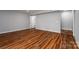 Spacious basement room with wood laminate flooring and walkout door at 122 Ardmore Pl, Mooresville, NC 28117