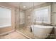 The updated bathroom features a soaking tub and a glass-enclosed shower at 122 Ardmore Pl, Mooresville, NC 28117