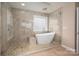 Modern bathroom showcasing free standing tub and large shower at 122 Ardmore Pl, Mooresville, NC 28117