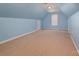 Finished bonus room with carpet, neutral paint, and window with blinds at 122 Ardmore Pl, Mooresville, NC 28117