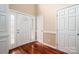 Bright foyer features a front door with sidelights, hardwood floors, and neutral wall paint at 122 Ardmore Pl, Mooresville, NC 28117